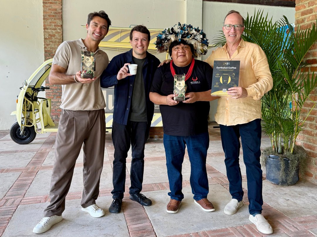Lucas Garcez, Marcelo Gregorio, an Indigenous leader and David Fein with Earthshot Coffee bags