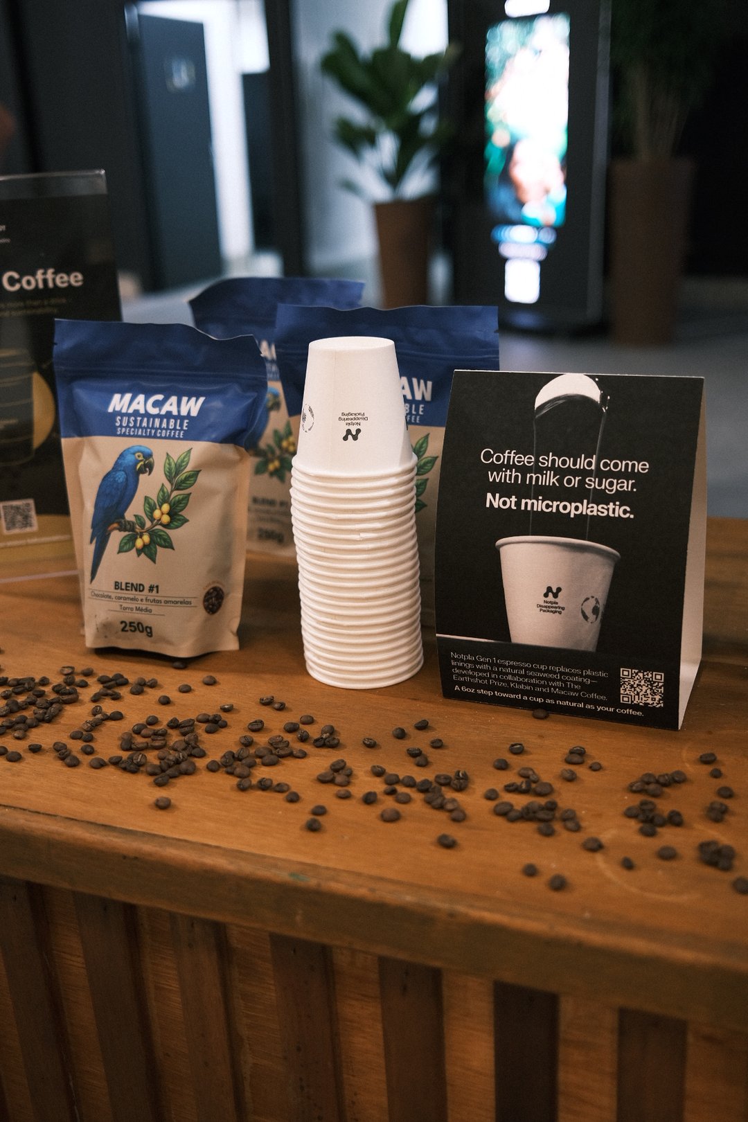 Macaw coffee bags and Notpla cups displayed at Earthshot
