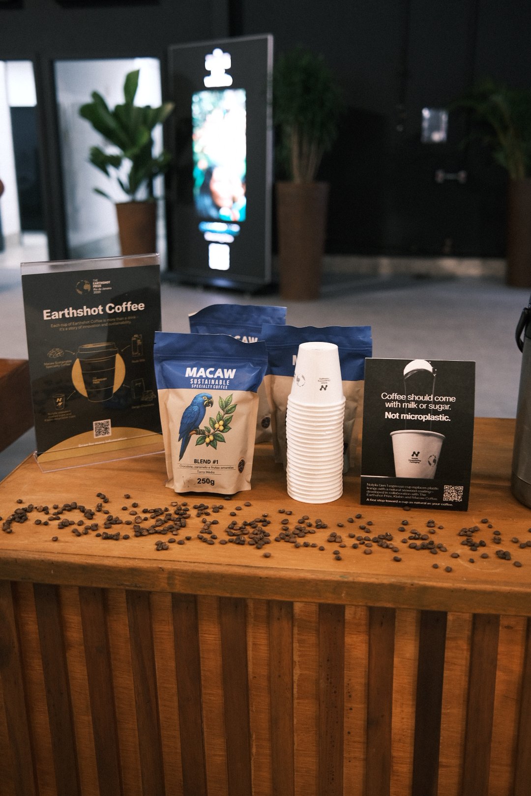 Macaw coffee bags and Notpla cups displayed at Earthshot