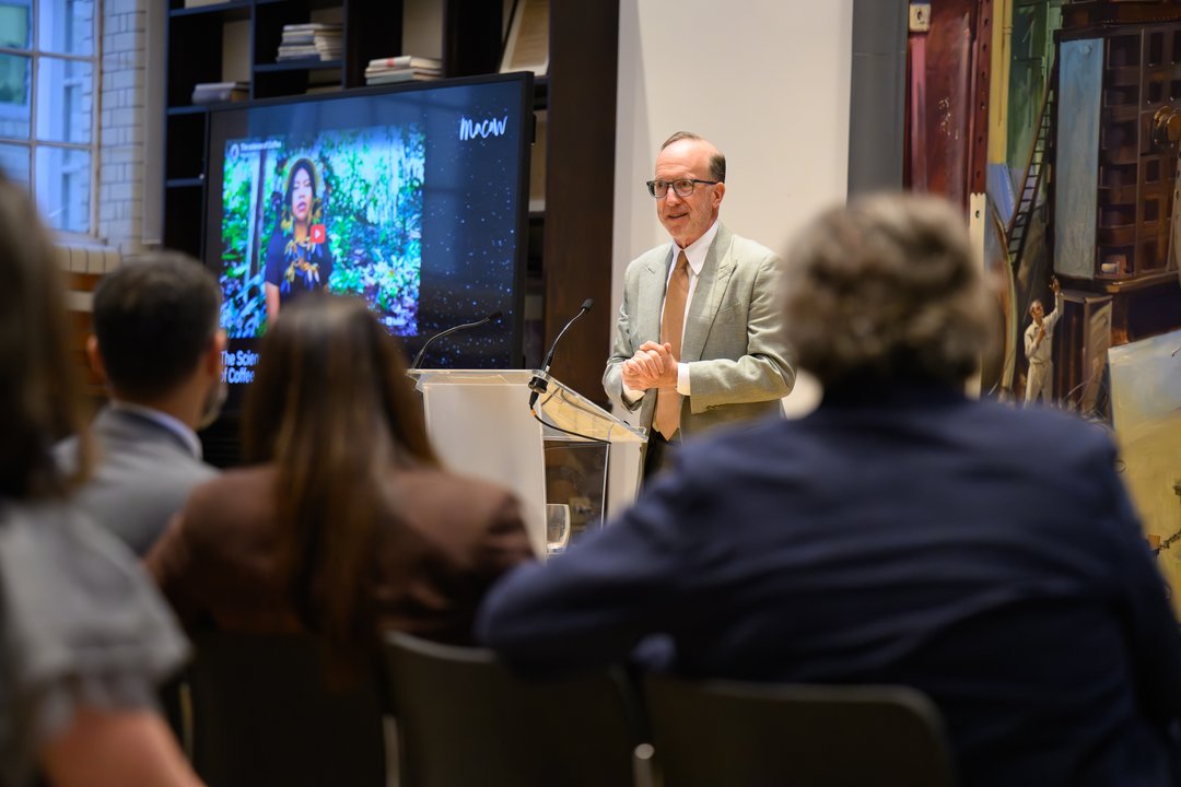 A speaker at the podium at The Science of Coffee