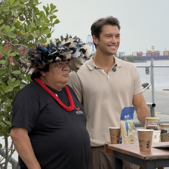 Lucas Garcez with an Indigenous leader at the Macaw stand
