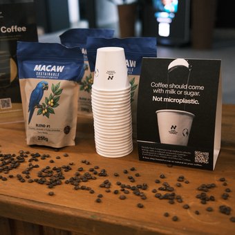 Macaw coffee bags and Notpla cups displayed at Earthshot