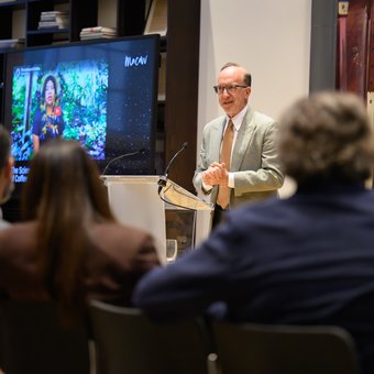 A speaker at the podium at The Science of Coffee