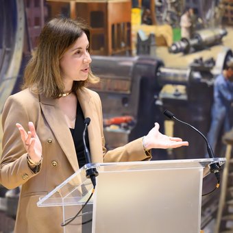 A speaker at the podium at The Science of Coffee