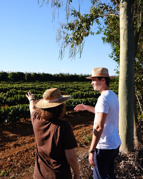 Paula Curiacos showing Lucas Garcez around the farm
